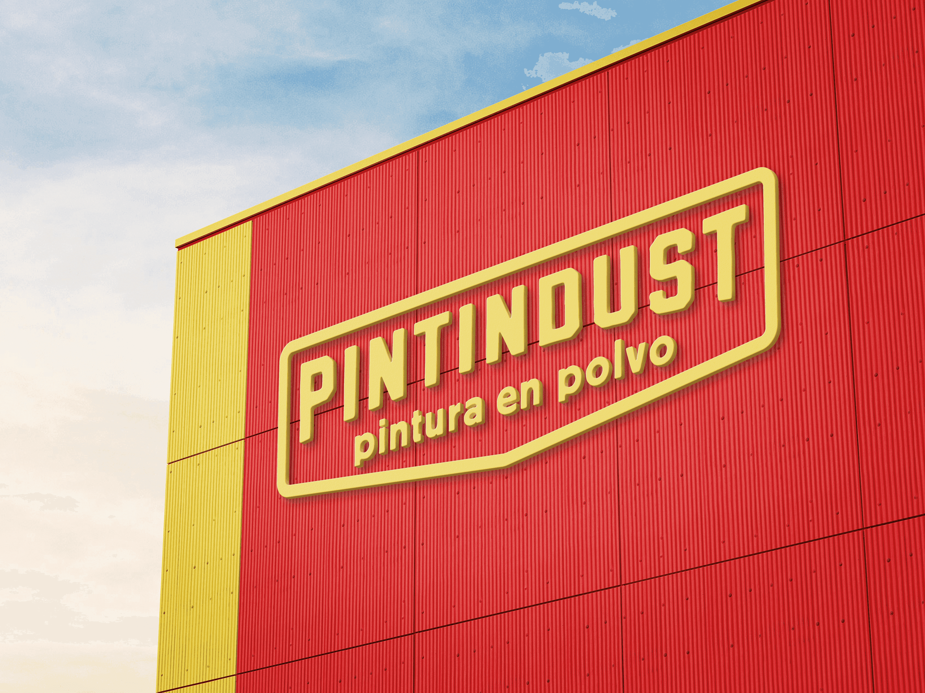 A factory building facade painted in PINTINDUST's corporate colors, featuring a large company logo that reinforces brand identity.